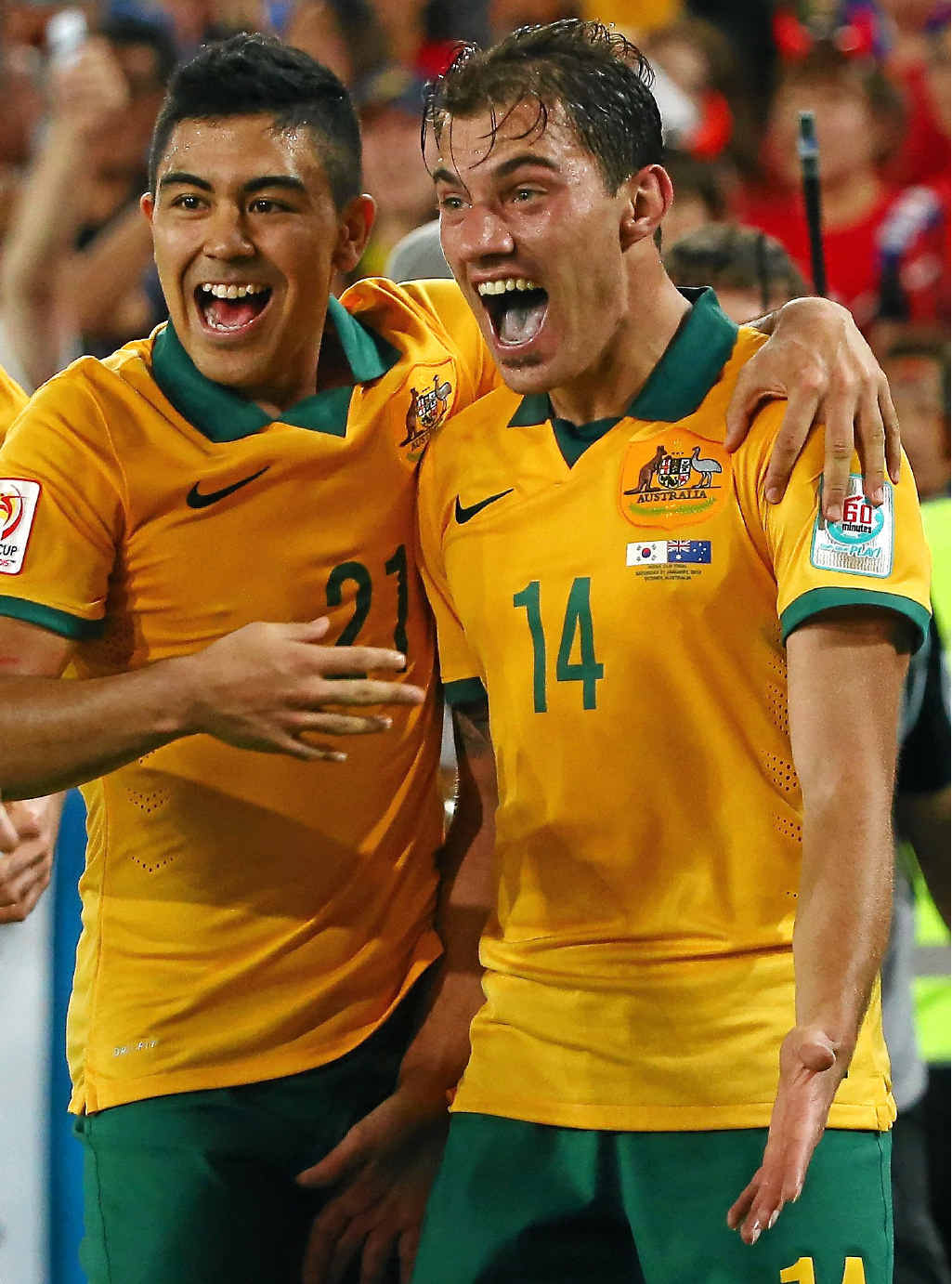 Australia’s James Troisi, right, celebrates with teammates after scoring in last night’s Asian Cup final. Australia’s James Troisi, right, celebrates with teammates after scoring in last night’s Asian Cup final.