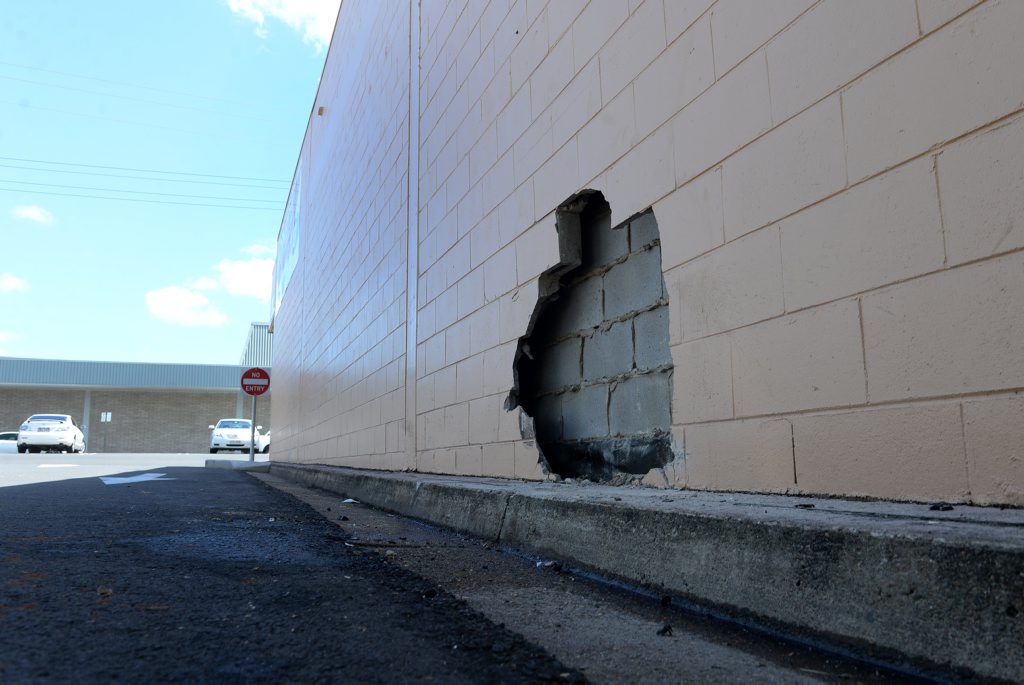 BIG HOLE: A car drove into the side wall of the IGA building in Woongarra St. Photo: Mike Knott / NewsMail BIG HOLE: A car drove into the side wall of the IGA building in Woongarra St. Photo: Mike Knott / NewsMail