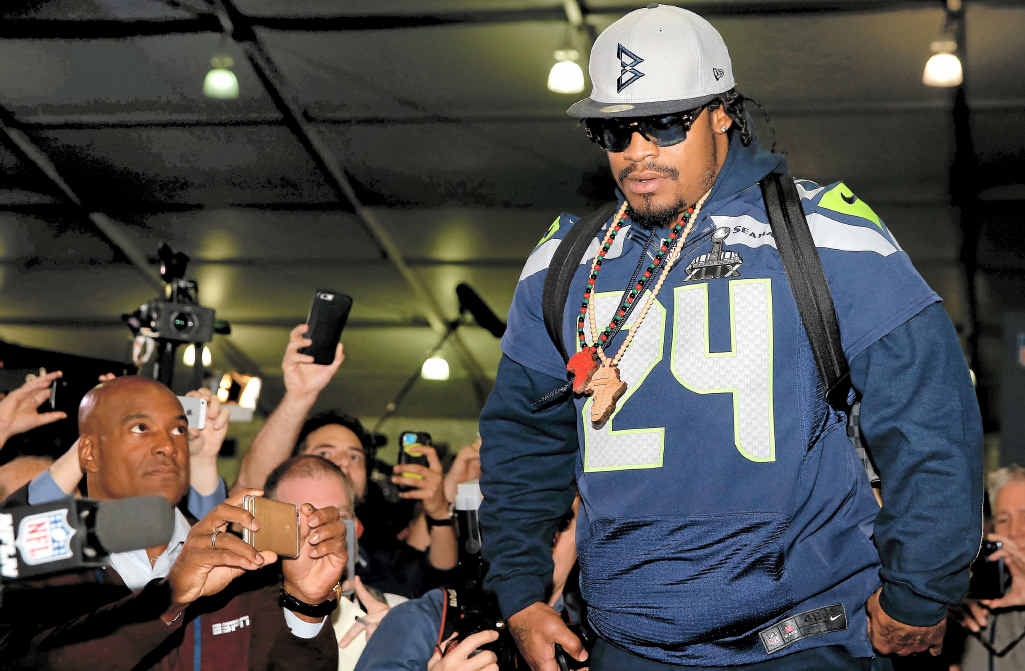 FEW WORDS: Running back Marshawn Lynch of the Seattle Seahawks arrives at a Super Bowl XLIX media conference at the Arizona Grand Hotel in Chandler, Arizona. FEW WORDS: Running back Marshawn Lynch of the Seattle Seahawks arrives at a Super Bowl XLIX media conference at the Arizona Grand Hotel in Chandler, Arizona.