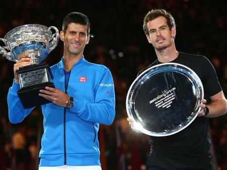 Djokovic holds his trophy next to runner-up Murray Djokovic holds his trophy next to runner-up Murray