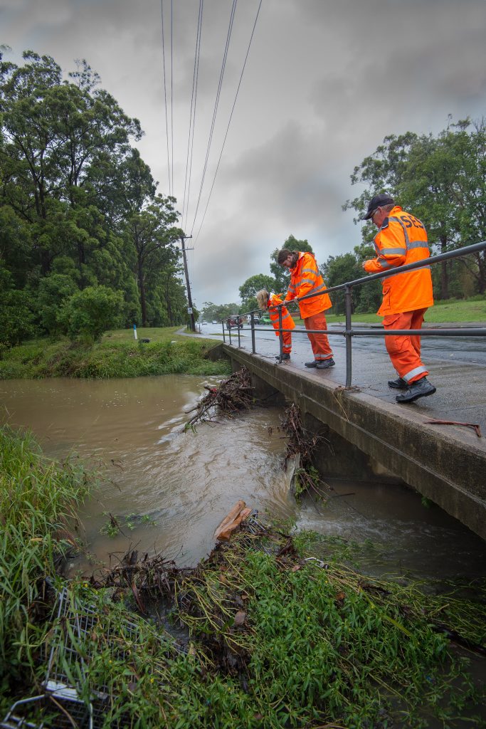 SES crew members Susie Moore, Terry Griffis and Derek Griffis inspect the rising water levels at Bray St. Photo: Trevor Veale / Coffs Coast Advocate SES crew members Susie Moore, Terry Griffis and Derek Griffis inspect the rising water levels at Bray St. Photo: Trevor Veale / Coffs Coast Advocate