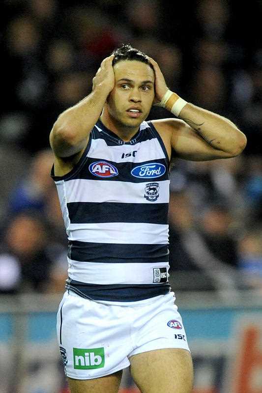 Allen Christensen of Geelong holds his head after a near miss, during the Round 21 AFL match between the Geelong Cats and Carlton Blues at Etihad stadium in Melbourne, Friday, 15 Aug. 2014. Allen Christensen of Geelong holds his head after a near miss, during the Round 21 AFL match between the Geelong Cats and Carlton Blues at Etihad stadium in Melbourne, Friday, 15 Aug. 2014.