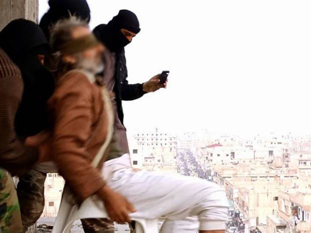 A disturbing image released on social media showing a man alleged to have had a 'homosexual affair' being thrown off a building. A disturbing image released on social media showing a man alleged to have had a 'homosexual affair' being thrown off a building.