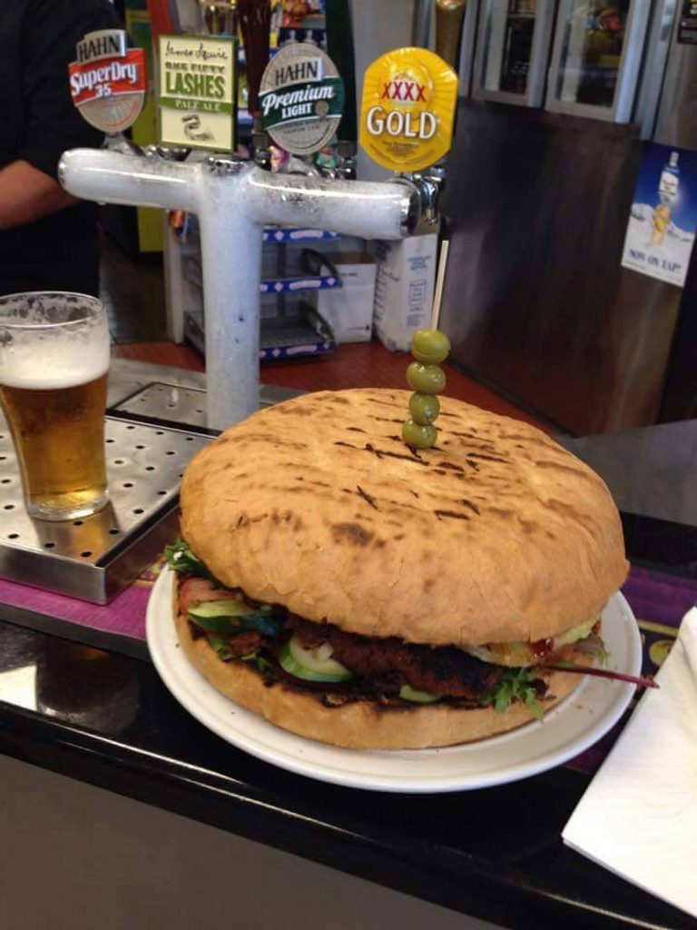 MOUTHFUL: The 1.2kg burger at the centre of the Lighthouse Hotel Motel's Beacon Burger Challenge. Photo Contributed MOUTHFUL: The 1.2kg burger at the centre of the Lighthouse Hotel Motel's Beacon Burger Challenge. Photo Contributed