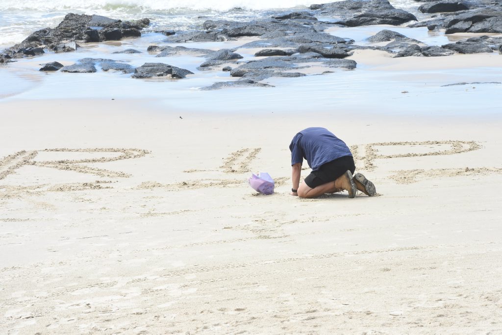 RIP TADASHI NAKAHARA: Neil Fitzgerald, of the Gold Coast, mourns the loss of his mate. The surfer died after being attacked by a shark at Shelly Beach, Ballina, on Monday morning. People have been visiting the site of the attack, to leave flowers and other memorials (above right) to the popular Japanese national. RIP TADASHI NAKAHARA: Neil Fitzgerald, of the Gold Coast, mourns the loss of his mate. The surfer died after being attacked by a shark at Shelly Beach, Ballina, on Monday morning. People have been visiting the site of the attack, to leave flowers and other memorials (above right) to the popular Japanese national.