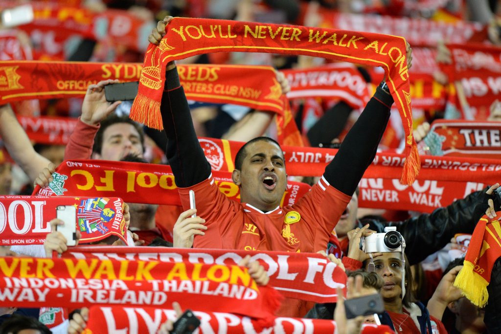 Liverpool supporters sing as they watch the match between Liverpool and the Melbourne Victory in a football friendly match at the MCG in Melbourne on July 24, 2013 Liverpool supporters sing as they watch the match between Liverpool and the Melbourne Victory in a football friendly match at the MCG in Melbourne on July 24, 2013