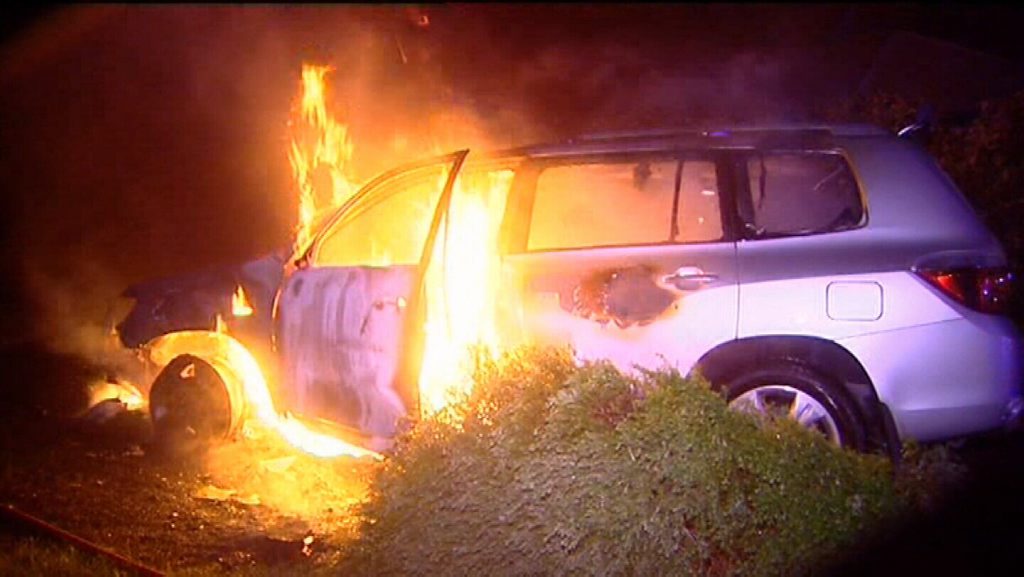 Middle Ridge resident Jack Gardner's car is engulfed in flames minutes after he was rescued from it by a neighbour. Photo Peter Collins, Channel 9 News Middle Ridge resident Jack Gardner's car is engulfed in flames minutes after he was rescued from it by a neighbour. Photo Peter Collins, Channel 9 News