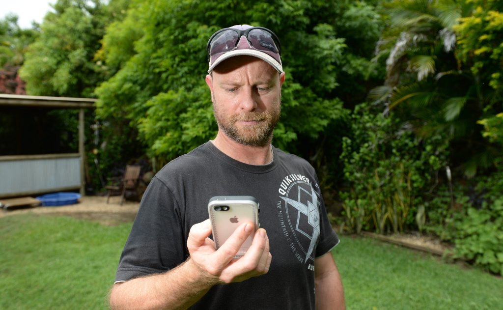 The only way Cawarral resident Matthew Maloney can keep in touch with the outside world is by standing in his backyard using his mobile phone. He has no landline or internet connection and mobile phone reception is so poor in the area it does not work inside his home. Photo: Chris Ison / The Morning Bulletin The only way Cawarral resident Matthew Maloney can keep in touch with the outside world is by standing in his backyard using his mobile phone. He has no landline or internet connection and mobile phone reception is so poor in the area it does not work inside his home. Photo: Chris Ison / The Morning Bulletin