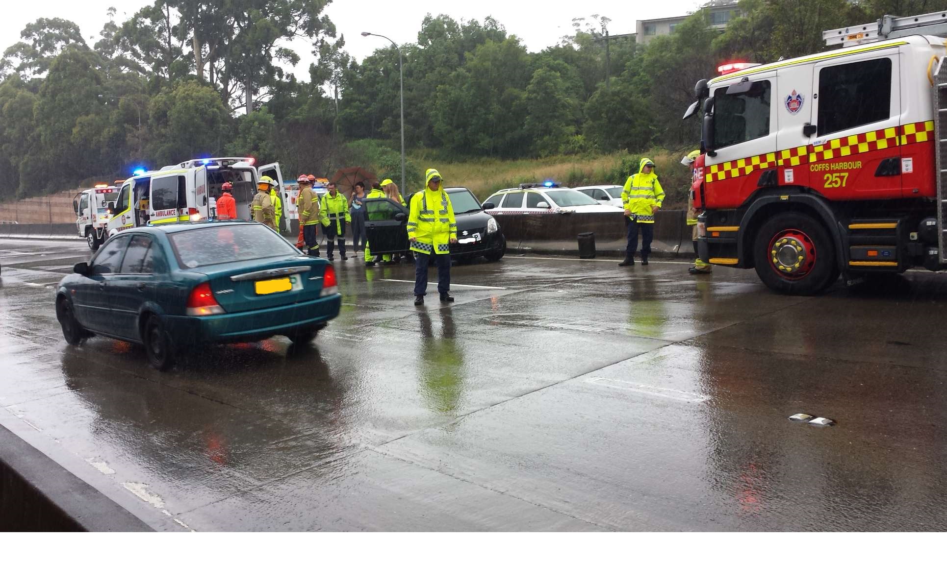 The scene of an accident on the Pacific Hwy near Park Beach Plaza on Thursday morning. The scene of an accident on the Pacific Hwy near Park Beach Plaza on Thursday morning.