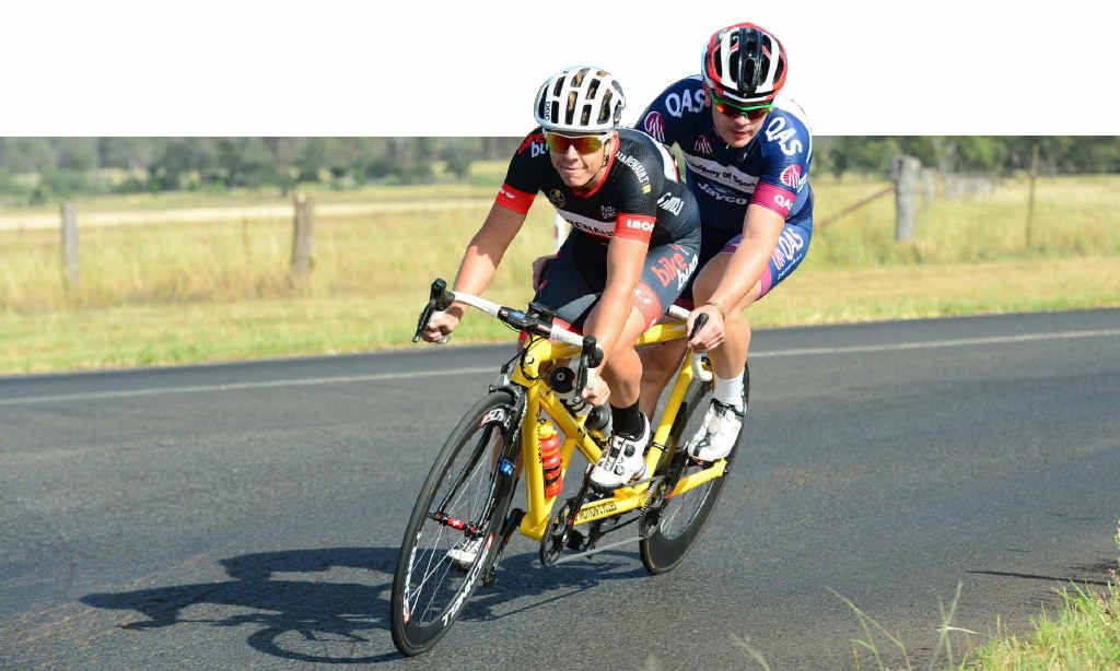 PULLING HIS WEIGHT: Yamba’s Aaron Watts rides pilot for vision-impaired mate Bryce Lindores on the way to victory in round one of the National Paracycling Series in Toowoomba. PHOTO: CONTRIBUTED PULLING HIS WEIGHT: Yamba’s Aaron Watts rides pilot for vision-impaired mate Bryce Lindores on the way to victory in round one of the National Paracycling Series in Toowoomba. PHOTO: CONTRIBUTED