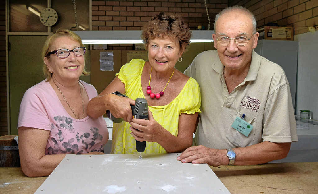 TRADING UP: Rita Davies, and Norm Thursby of the Buderim Men’s Shed, look on as Laureen Delaney learns to drill a hole during the women’s maintenance workshop at the shed. TRADING UP: Rita Davies, and Norm Thursby of the Buderim Men’s Shed, look on as Laureen Delaney learns to drill a hole during the women’s maintenance workshop at the shed.
