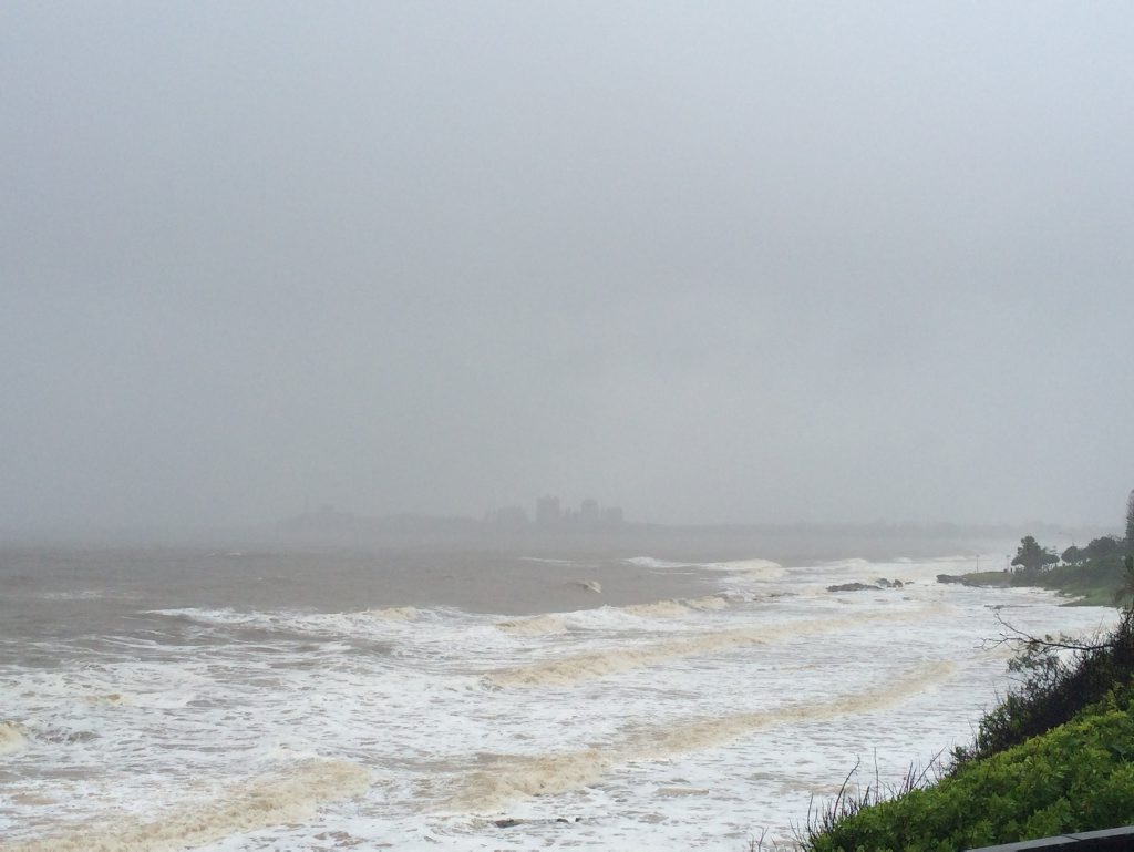 Grey and glooming skies over a murky and wild Mooloolaba beach. The Point Cartwright lighthouse barely visible. Photo: Megan Mackander Grey and glooming skies over a murky and wild Mooloolaba beach. The Point Cartwright lighthouse barely visible. Photo: Megan Mackander