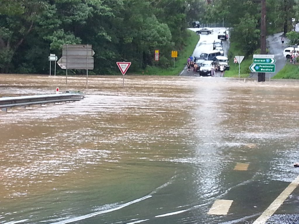 The intersection of Old Gympie Rd and Peachester Rd, Beerwah. is one metre underwater and residents along Old Gympie Road have been cut off from town and also from Glasshouse Mountains, effectively isolating them as of Friday night. Photo: Chris Rawlins The intersection of Old Gympie Rd and Peachester Rd, Beerwah. is one metre underwater and residents along Old Gympie Road have been cut off from town and also from Glasshouse Mountains, effectively isolating them as of Friday night. Photo: Chris Rawlins