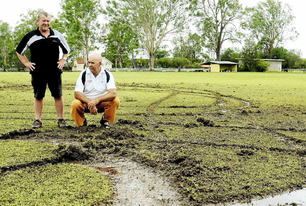 REPAIR DESPAIR: Clarence River Cricket Association grounds committee representative Terry Brien and Coutts Crossing Cricket Club vice-president Dean Clark survey the damage on the cricket field at McIntosh Park. REPAIR DESPAIR: Clarence River Cricket Association grounds committee representative Terry Brien and Coutts Crossing Cricket Club vice-president Dean Clark survey the damage on the cricket field at McIntosh Park.