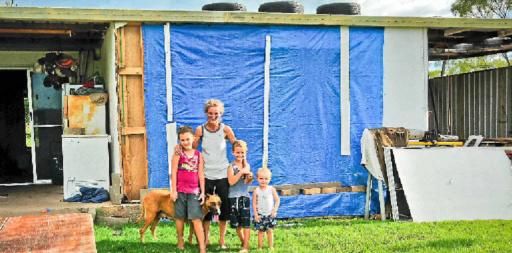GONE WITH THE WIND: Patricia Brough and Declan, 7, Shannon, 5, and Chad Fall, 2, are disappointed they were told they were not eligible for disaster relief after Tropical Cyclone Marcia tore the front wall from of their Mt Larcom home. GONE WITH THE WIND: Patricia Brough and Declan, 7, Shannon, 5, and Chad Fall, 2, are disappointed they were told they were not eligible for disaster relief after Tropical Cyclone Marcia tore the front wall from of their Mt Larcom home.