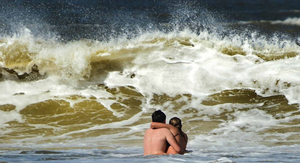 BEWARE: Swimmers brave muddy water at Alex. BEWARE: Swimmers brave muddy water at Alex.