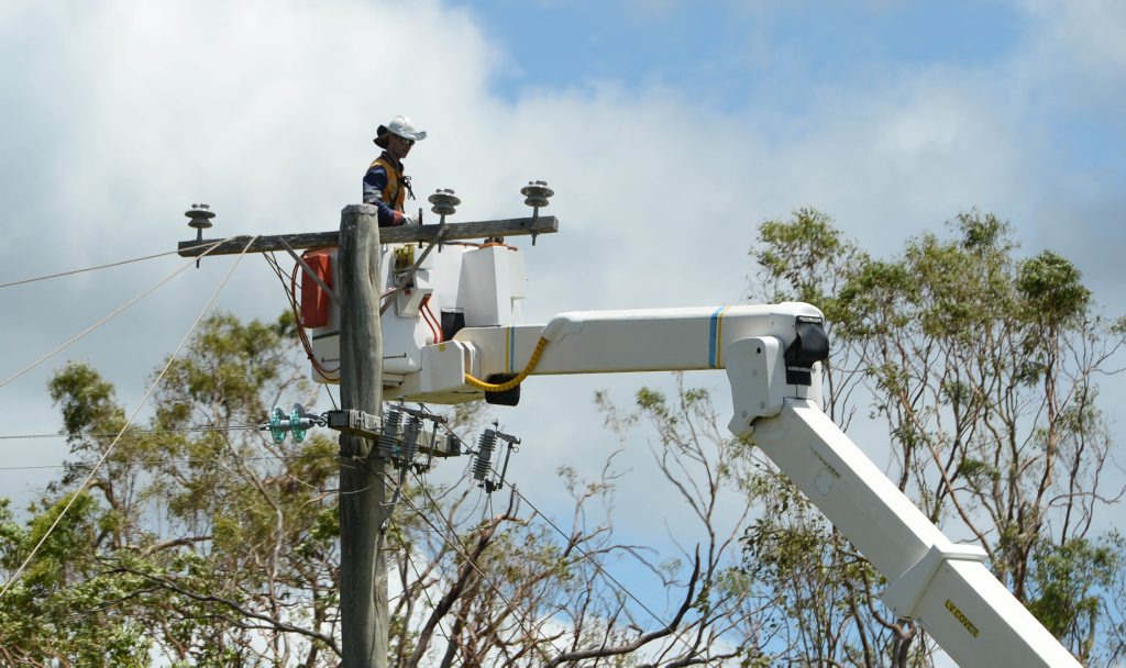 Ergon and Energex workers help restore power lines and poles along Adelaide Park Road Yeppoon after Cyclone Marcia left tens of thousands of homes without power across the region. Photo: Chris Ison / The Morning Bulletin Ergon and Energex workers help restore power lines and poles along Adelaide Park Road Yeppoon after Cyclone Marcia left tens of thousands of homes without power across the region. Photo: Chris Ison / The Morning Bulletin