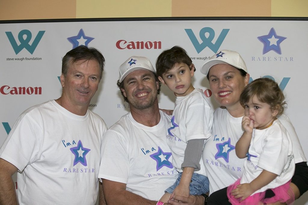 Ashton Hayes with (from left) Steve Waugh, dad Phil Hayes, mum Angela Matthew and his little sister, Eliza Mae, at the Steve Waugh Foundation's Rare Stars event last year, moments before Ashton took his first steps. Photo Contributed Ashton Hayes with (from left) Steve Waugh, dad Phil Hayes, mum Angela Matthew and his little sister, Eliza Mae, at the Steve Waugh Foundation's Rare Stars event last year, moments before Ashton took his first steps. Photo Contributed