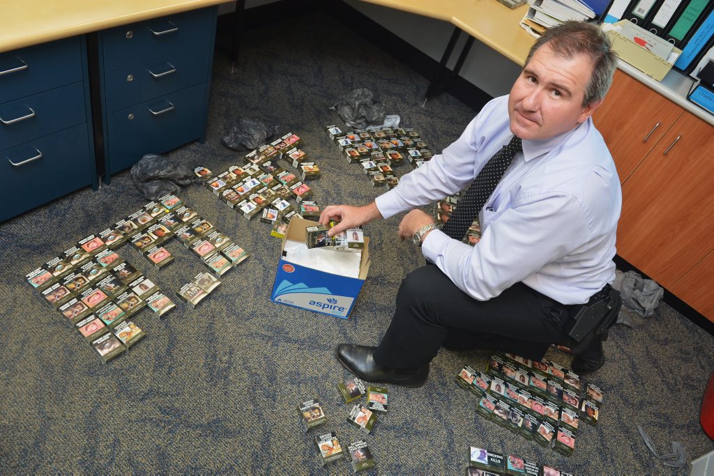 Gympie CIB, Detective Sargeant Rob Lowry with cigarette haul from Heilbronn's Store, Duke Street, Gympie. Photo: Greg Miller / Gympie Times Gympie CIB, Detective Sargeant Rob Lowry with cigarette haul from Heilbronn's Store, Duke Street, Gympie. Photo: Greg Miller / Gympie Times