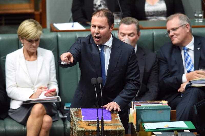 Foreign Minister Julie Bishop (left), Education Minister Christopher Pyne (second right) and Social Services Minister Scott Morrison (right) watch from the frontbench as Federal Assistant Treasurer Josh Frydenberg speaks and points at the opposition while at the despatch box during Question Time at Parliament House in Canberra, Monday, Feb. 23, 2015. Foreign Minister Julie Bishop (left), Education Minister Christopher Pyne (second right) and Social Services Minister Scott Morrison (right) watch from the frontbench as Federal Assistant Treasurer Josh Frydenberg speaks and points at the opposition while at the despatch box during Question Time at Parliament House in Canberra, Monday, Feb. 23, 2015.