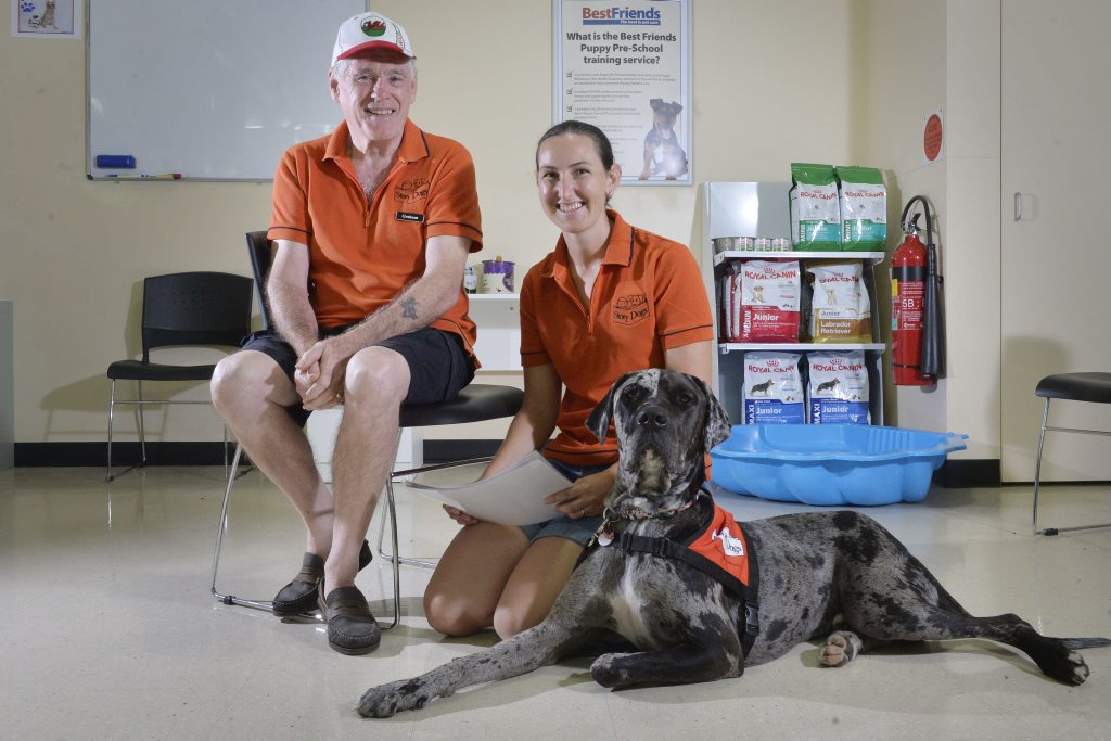 READY TO LISTEN: Volunteer Kelly Schoormans with her dog Clyde and Graham Mathias are working with Best Friends Pet Care in West Ipswich to start the Story Dogs program in local primary schools. READY TO LISTEN: Volunteer Kelly Schoormans with her dog Clyde and Graham Mathias are working with Best Friends Pet Care in West Ipswich to start the Story Dogs program in local primary schools.