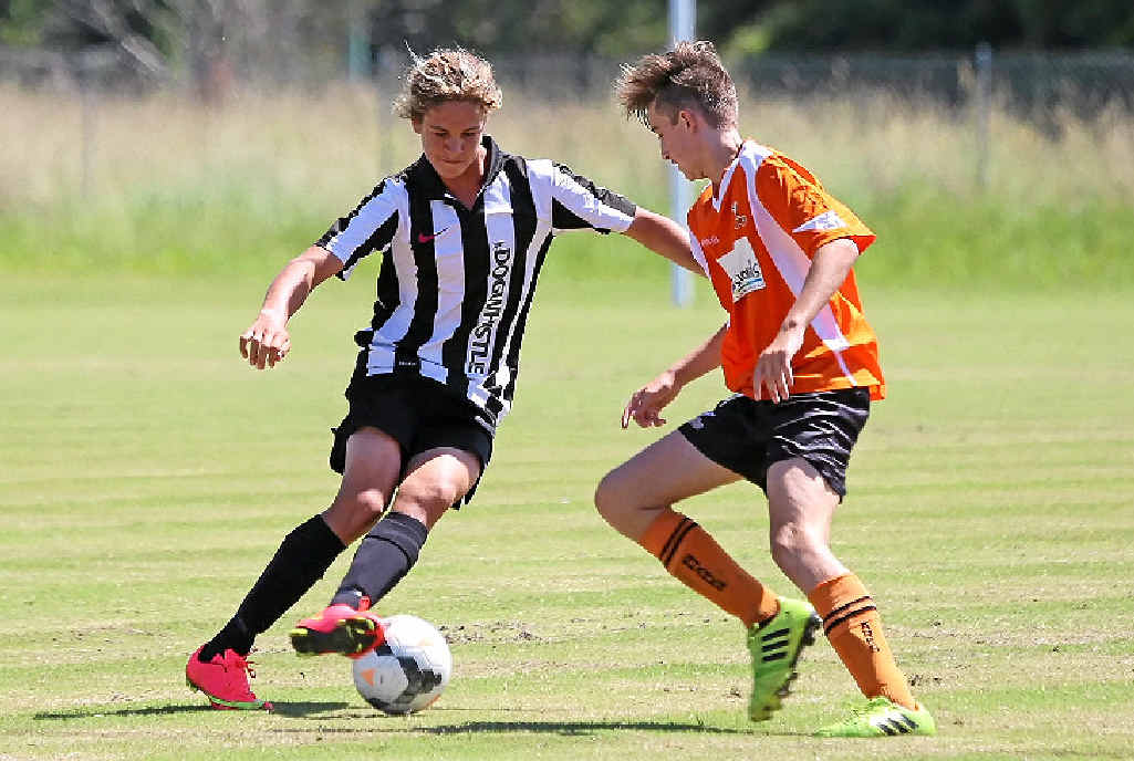 Byron’s under-16 corner king Harrison Kent takes on the Lennox defence. Byron’s under-16 corner king Harrison Kent takes on the Lennox defence.