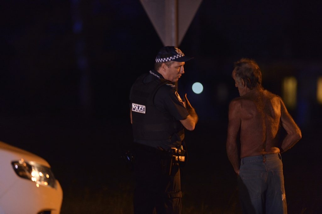 Police speak to a man near the scene of a triple fatal shooting near Toowoomba. Police speak to a man near the scene of a triple fatal shooting near Toowoomba.
