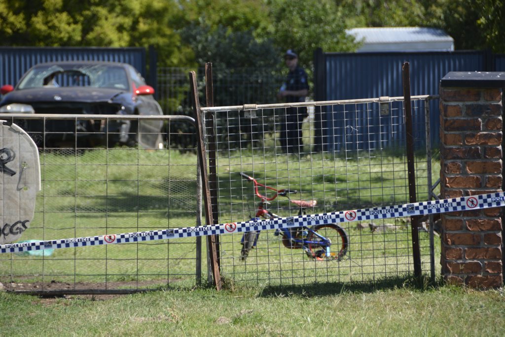 A child's pushbike sits in the yard of a Biddeston home where a man, woman and child were found dead on March 2, 2015. A child's pushbike sits in the yard of a Biddeston home where a man, woman and child were found dead on March 2, 2015.