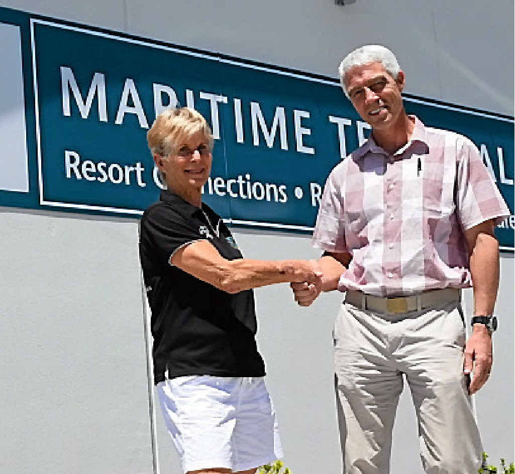OFF AND RUNNING: Airlie Beach Running Festival organiser Wendy Downes with Cruise Whitsundays CEO Nick Hortle. Mr Hortle and Cruise Whitsundays will again be major sponsors of the annual event.