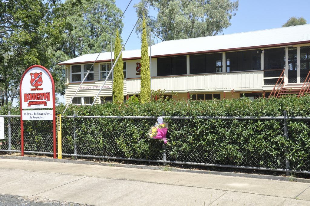 A floral tribute and message left for a seven-year-old Biddeston State School student who was murdered. Photo Stuart Cumming / The Chronicle A floral tribute and message left for a seven-year-old Biddeston State School student who was murdered. Photo Stuart Cumming / The Chronicle