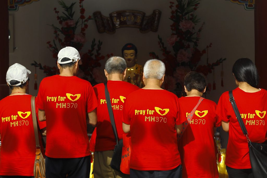 epa04642580 Relatives of Chinese passengers from the missing Malaysia Airlines flight MH370 attend prayers in Thean Hou temple, Kuala Lumpur, Malaysia, 01 March 2015. Beijing-bound flight MH370 disappeared about an hour after it left Kuala Lumpur International Airport on 08 March 2014. About two-thirds of the 239 passengers were Chinese nationals. Malaysia has declared the disappearance of MH370 an accident and said all aboard are presumed dead. EPA/FAZRY ISMAIL epa04642580 Relatives of Chinese passengers from the missing Malaysia Airlines flight MH370 attend prayers in Thean Hou temple, Kuala Lumpur, Malaysia, 01 March 2015. Beijing-bound flight MH370 disappeared about an hour after it left Kuala Lumpur International Airport on 08 March 2014. About two-thirds of the 239 passengers were Chinese nationals. Malaysia has declared the disappearance of MH370 an accident and said all aboard are presumed dead. EPA/FAZRY ISMAIL