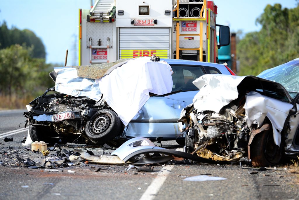 DOUBLE FATAL: Emergency services attend the scene of a crash on the Isis Highway in which two people died. The crash occured early on 21 August, 2014 when two vehicles collided head on. Photo: Max Fleet / NewsMail DOUBLE FATAL: Emergency services attend the scene of a crash on the Isis Highway in which two people died. The crash occured early on 21 August, 2014 when two vehicles collided head on. Photo: Max Fleet / NewsMail