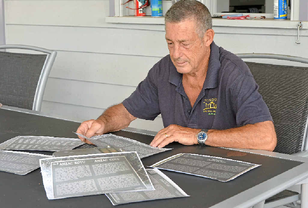 Eric Winn looks over photographs of the original plaques placed at Gallipoli. Eric Winn looks over photographs of the original plaques placed at Gallipoli.
