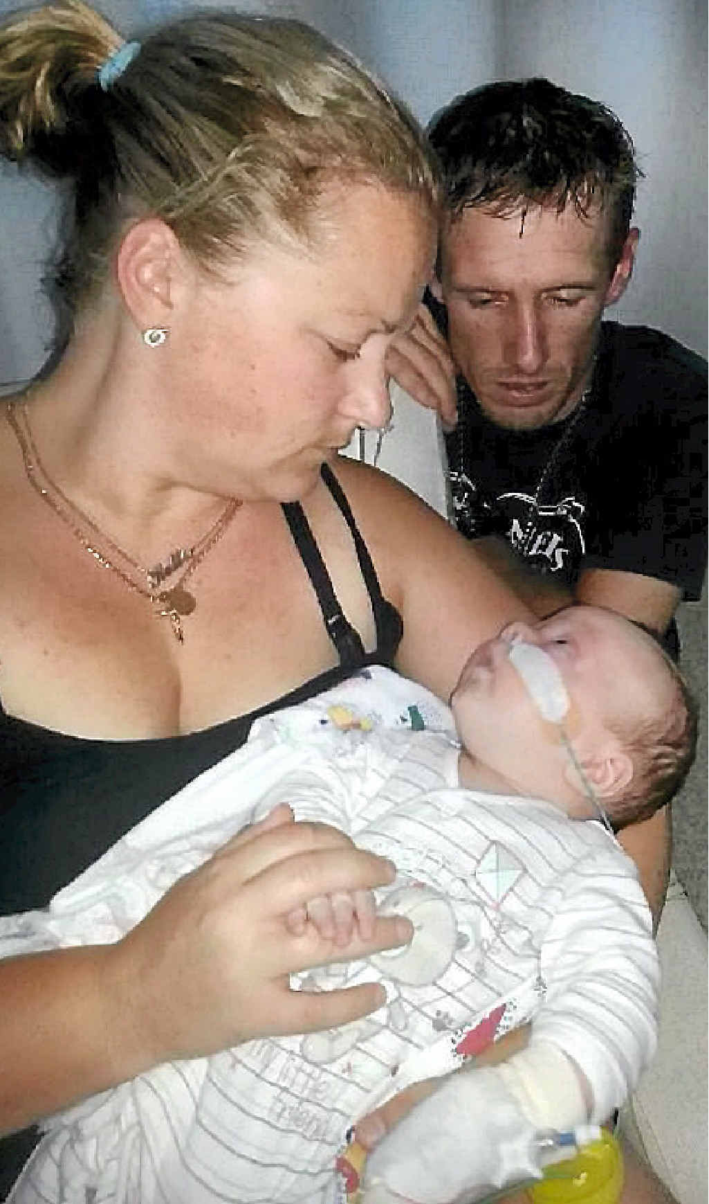 BRAVE FIGHT: Rockhampton couple Kellie and Darren Evans with their 10-week-old son Brooklyn, who is currently in ICU after he stopped breathing and started having seizures following his routine vaccinations. BRAVE FIGHT: Rockhampton couple Kellie and Darren Evans with their 10-week-old son Brooklyn, who is currently in ICU after he stopped breathing and started having seizures following his routine vaccinations.