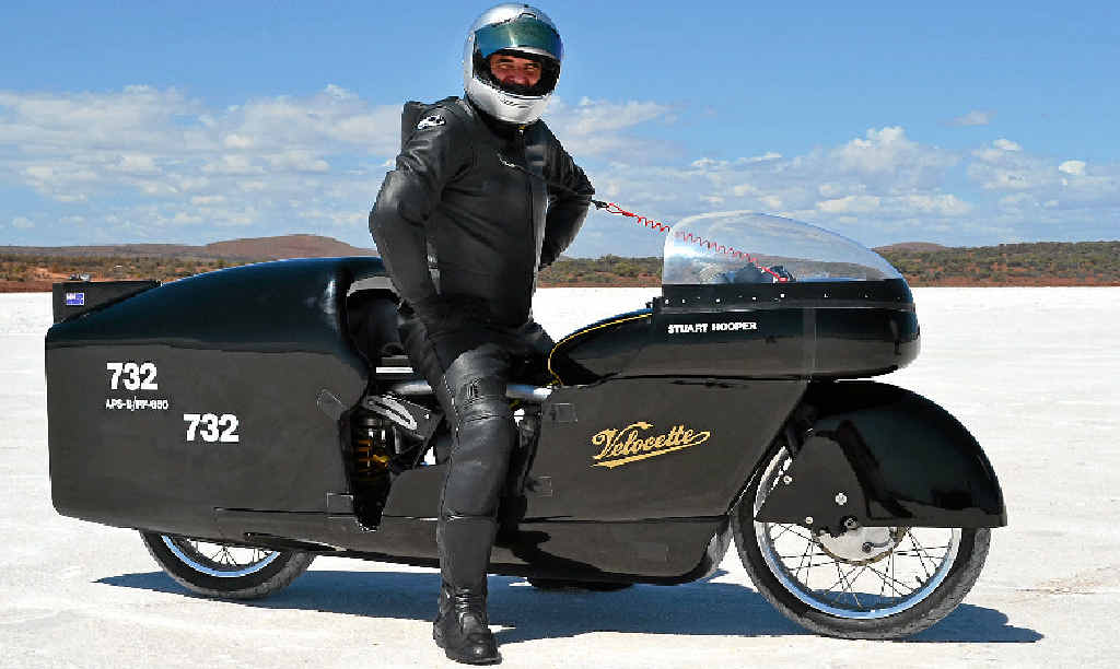 TOP GEAR: Yandina’s Stuart Hooper with his world record-breaking Velocette at Lake Gairdner in South Australia. TOP GEAR: Yandina’s Stuart Hooper with his world record-breaking Velocette at Lake Gairdner in South Australia.