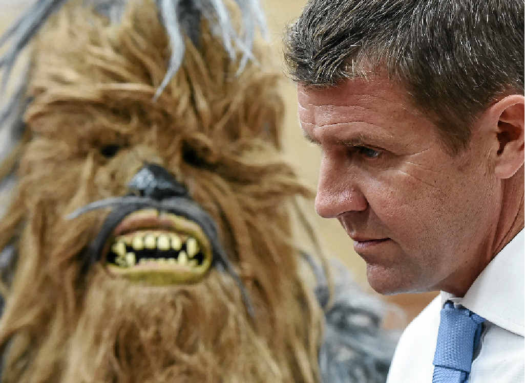 CHEW-ING THE FAT: The Queanbeyan Yowies’ mascot has Premier Mike Baird’s ear. CHEW-ING THE FAT: The Queanbeyan Yowies’ mascot has Premier Mike Baird’s ear.