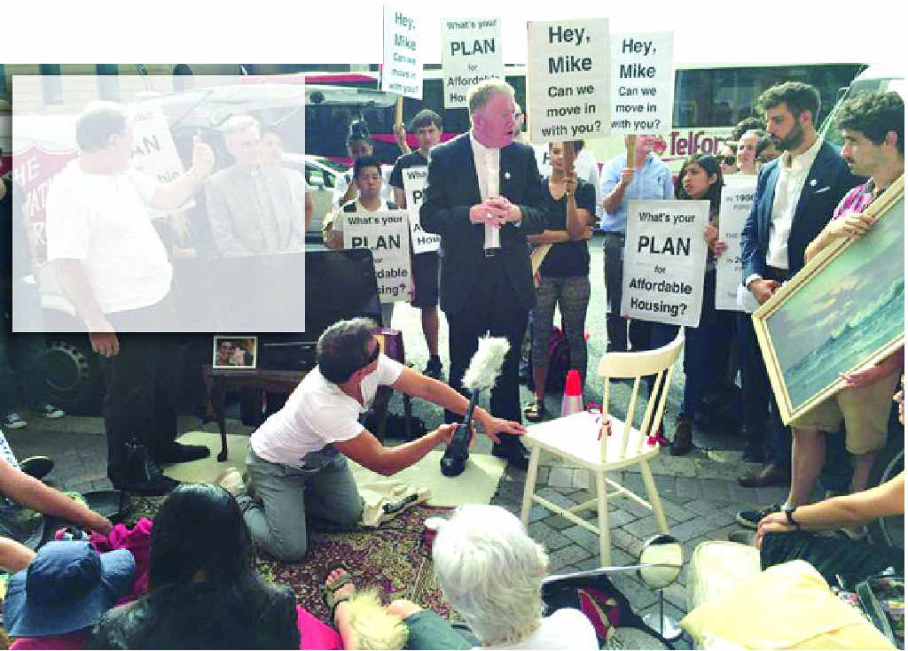 SETTING UP SHOP: Auxiliary Bishop of Sydney Terry Brady leads protesters at Parliament House as they try to “move in with Mike Baird”. SETTING UP SHOP: Auxiliary Bishop of Sydney Terry Brady leads protesters at Parliament House as they try to “move in with Mike Baird”.