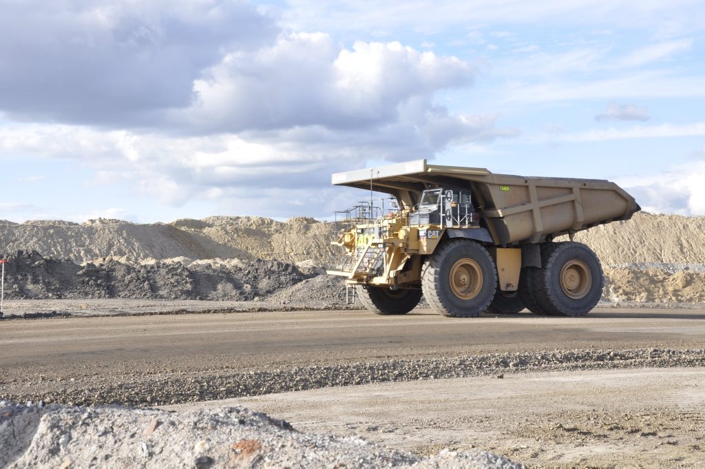 A dump truck heads out of a pit at New Acland coal mine. Photo: Stuart Cumming / The Chronicle A dump truck heads out of a pit at New Acland coal mine. Photo: Stuart Cumming / The Chronicle