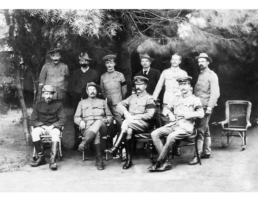 General Kitchener (front, second from right) and Colonel Ian Hamilton (front, far right), pictured at a peace conference in the Boer War in February 1901, just prior to Hamilton becoming Kitchener's chief-of-staff. General Kitchener (front, second from right) and Colonel Ian Hamilton (front, far right), pictured at a peace conference in the Boer War in February 1901, just prior to Hamilton becoming Kitchener's chief-of-staff.