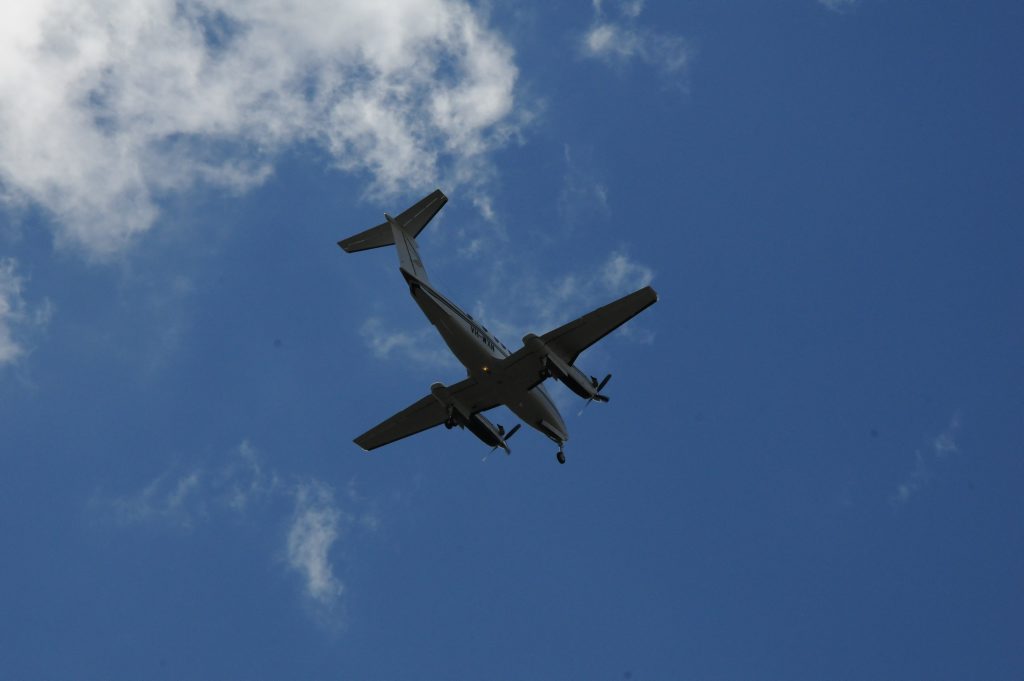 A Beechcraft Super King Air makes a low pass over Toowoomba Airport so ground crew can inspect an apparently faulty nosewheel. A Beechcraft Super King Air makes a low pass over Toowoomba Airport so ground crew can inspect an apparently faulty nosewheel.