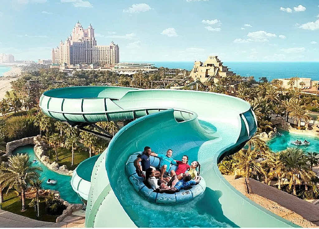 Take a fast and wet ride down a twisting chute sitting in a big tube into a lagoon full of sharks. Take a fast and wet ride down a twisting chute sitting in a big tube into a lagoon full of sharks.
