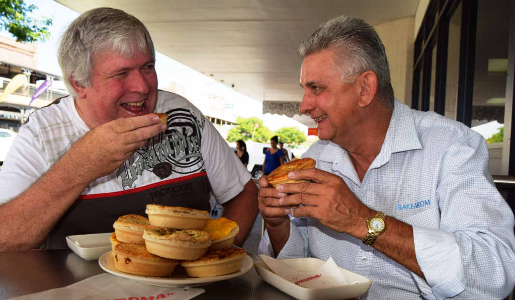 DELICIOUS: Loyal Bakearoma customer Ian Holberton and manager Kevin Jarick enjoy tasty old-fashioned pies ahead of the pie-eating contest. DELICIOUS: Loyal Bakearoma customer Ian Holberton and manager Kevin Jarick enjoy tasty old-fashioned pies ahead of the pie-eating contest.