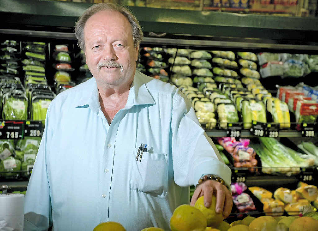 LOVING IT: Rod Neill loves his fruit, veg and betting on horses out the back of his shop, Rod’s Food Market. LOVING IT: Rod Neill loves his fruit, veg and betting on horses out the back of his shop, Rod’s Food Market.