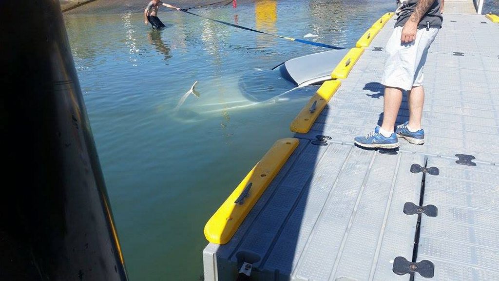 A salvage attempt at Coffs Harbour's boat ramp begins after a Honda Civic was submerged underwater there. Photo credit: Tim Shaw A salvage attempt at Coffs Harbour's boat ramp begins after a Honda Civic was submerged underwater there. Photo credit: Tim Shaw