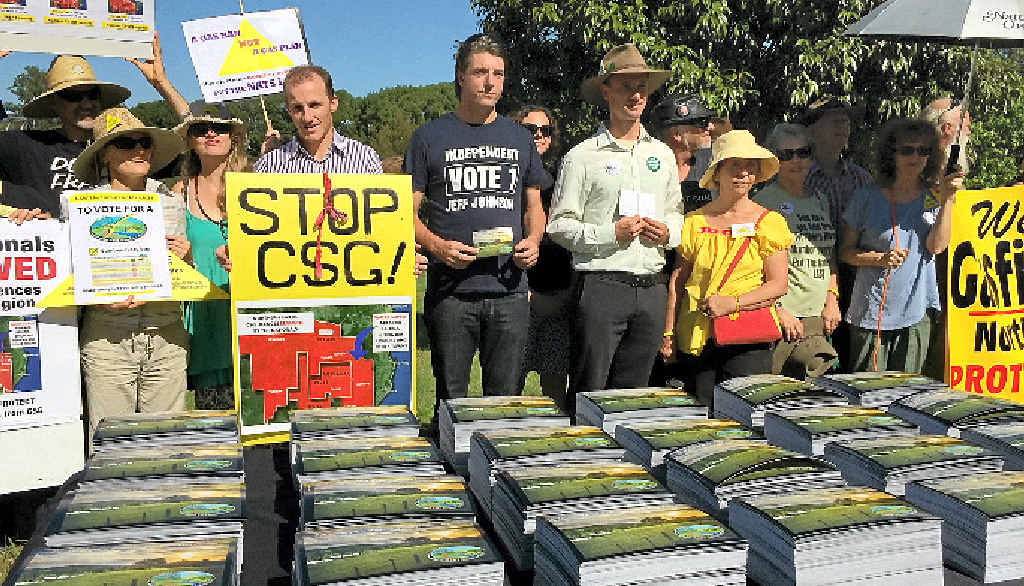UNITED WE STAND: State Election candidates alongside Gasfield Free campaigners and the 6000 postcards calling for a gas ban. Pictured is Lismore Labor candidate Isaac Smith (centre left with “Stop CSG” placard), Ballina independent candidate Jeff Johnson (centre) and Lismore Greens candidate Adam Guise (centre right, with postcard). UNITED WE STAND: State Election candidates alongside Gasfield Free campaigners and the 6000 postcards calling for a gas ban. Pictured is Lismore Labor candidate Isaac Smith (centre left with “Stop CSG” placard), Ballina independent candidate Jeff Johnson (centre) and Lismore Greens candidate Adam Guise (centre right, with postcard).