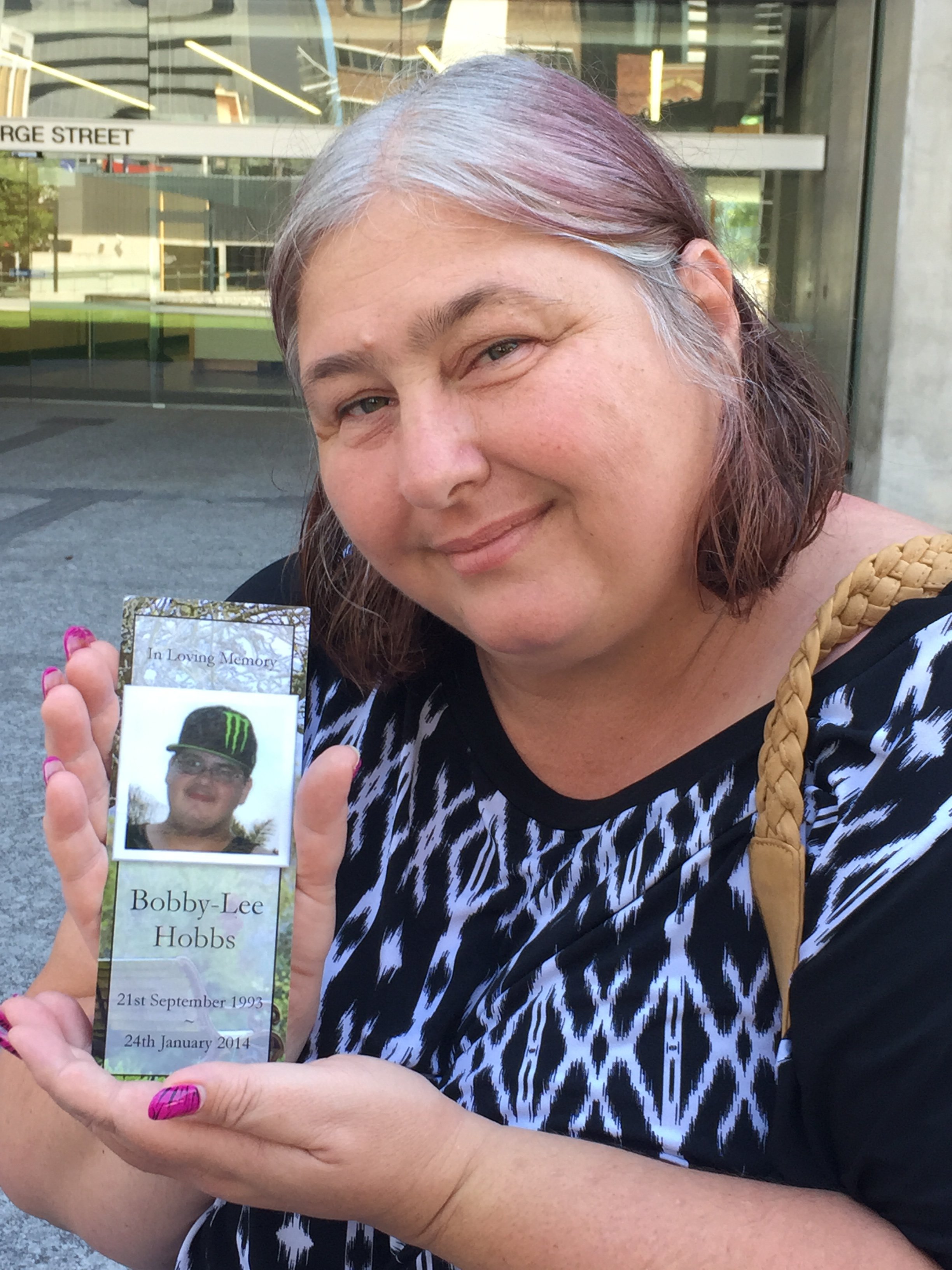 Mackay mother Tina Clarke hold a picture of her son Bobby Lee Hobbs, 20. Mackay mother Tina Clarke hold a picture of her son Bobby Lee Hobbs, 20.