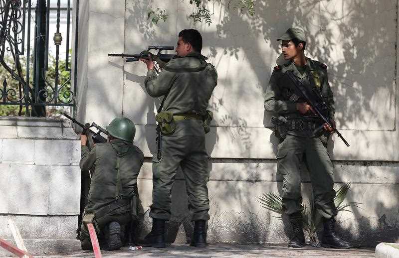 Members of the Tunisian armed forces take up positions during an operation against gunmen who opened fire on tourists at the National Bardo Museum, Tunis, Tunisia, 18 March 2015. Members of the Tunisian armed forces take up positions during an operation against gunmen who opened fire on tourists at the National Bardo Museum, Tunis, Tunisia, 18 March 2015.