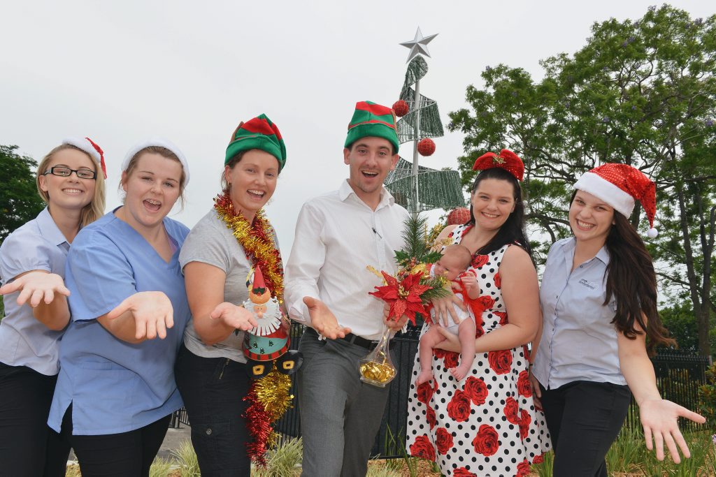 Apex president Sam Johnson with Kristy Herrod, who co-ordinated the 2014 Apex Santa Fair, with three-week-old Juliet. Apex president Sam Johnson with Kristy Herrod, who co-ordinated the 2014 Apex Santa Fair, with three-week-old Juliet.