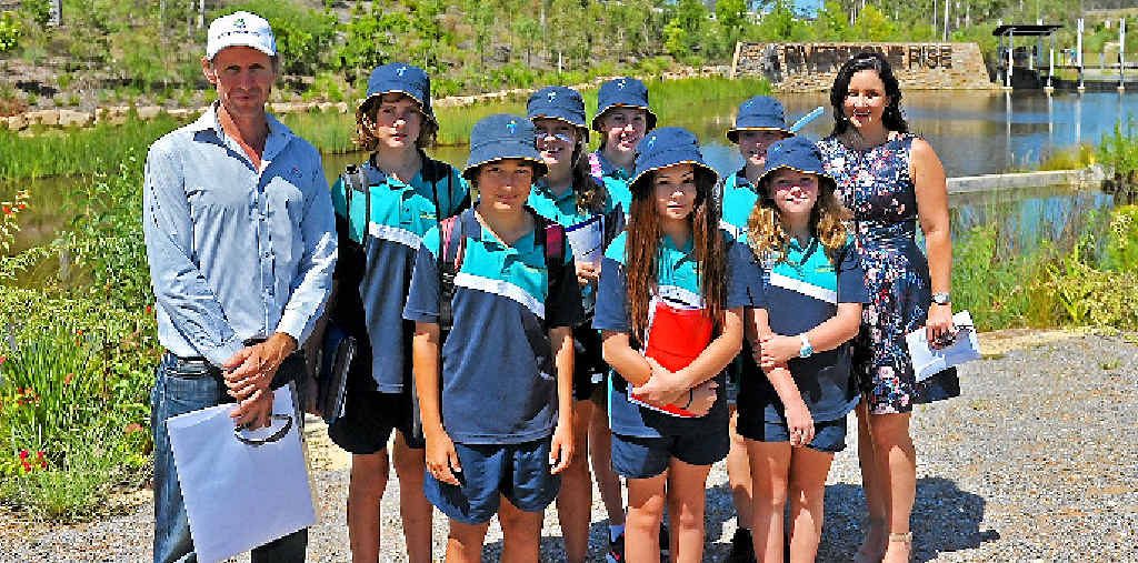 GREAT EXPECTATIONS: The water filtration system in place at Riverstone Rise is an Australian first development. Engineer Chris Camp from Coveys explains the process to Year 7 students from Tannum Sands State High School Sam Spencer-Galvin, Kai Buchan, Ella Humberston, Meg Ryder, Jasmin Doughty-Ang, Ciara Roberts, Jorja Hempenstall and community engagement officer Joanna Witt. GREAT EXPECTATIONS: The water filtration system in place at Riverstone Rise is an Australian first development. Engineer Chris Camp from Coveys explains the process to Year 7 students from Tannum Sands State High School Sam Spencer-Galvin, Kai Buchan, Ella Humberston, Meg Ryder, Jasmin Doughty-Ang, Ciara Roberts, Jorja Hempenstall and community engagement officer Joanna Witt.