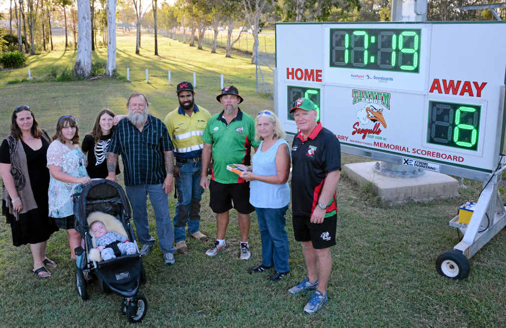 REMEMBERING TINA: Benita Warry, Destiny Hindmarsh, Trinity Hindmarsh, Carter Burton (four months), Wayne ‘Snarb’ Warry, Keorge Kepa, Shane Fett, Donna Warry and Bill Potts with the Tina Marie Warry Memorial Scoreboard donated to the Tannum Sands Seagulls. REMEMBERING TINA: Benita Warry, Destiny Hindmarsh, Trinity Hindmarsh, Carter Burton (four months), Wayne ‘Snarb’ Warry, Keorge Kepa, Shane Fett, Donna Warry and Bill Potts with the Tina Marie Warry Memorial Scoreboard donated to the Tannum Sands Seagulls.